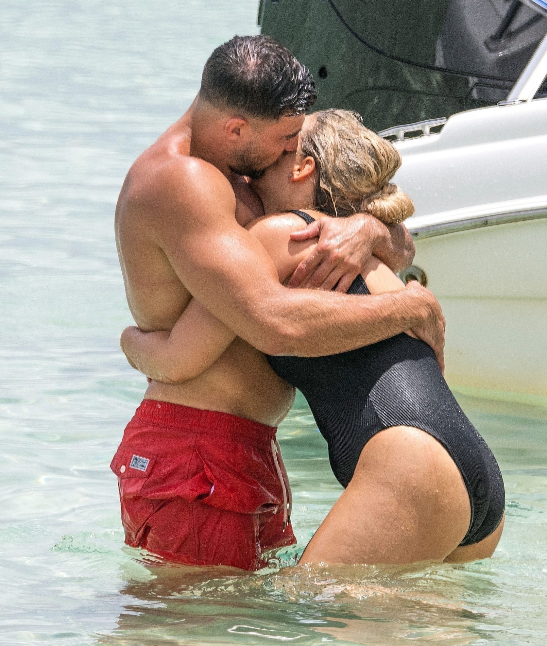 Molly Mae Hague and Tommy Fury look more loved up than ever as they kiss in the sea in Barbados