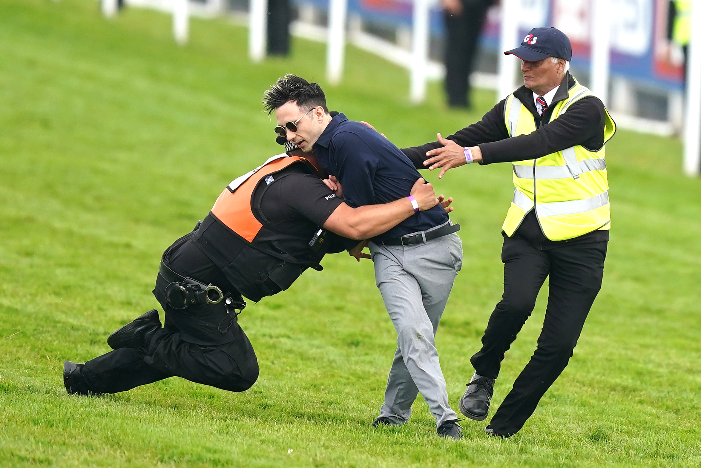 Protestor sprinting on Epsom Derby racecourse tackled as animal activists’ plot to disrupt race is foiled
