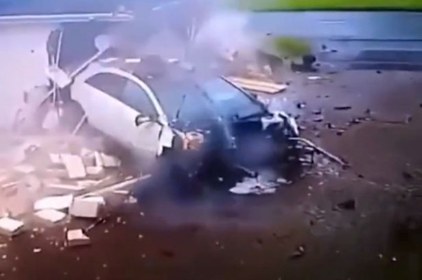 Dramatic moment Mercedes crashes into garage before teens stumble out of smoking wreckage