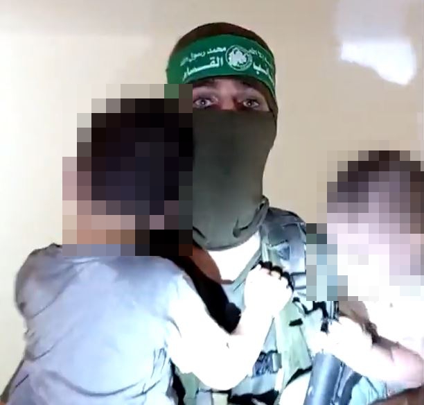 Sickening video shows Hamas killers clutching kidnapped babies and toddlers during civilian massacre in Israel