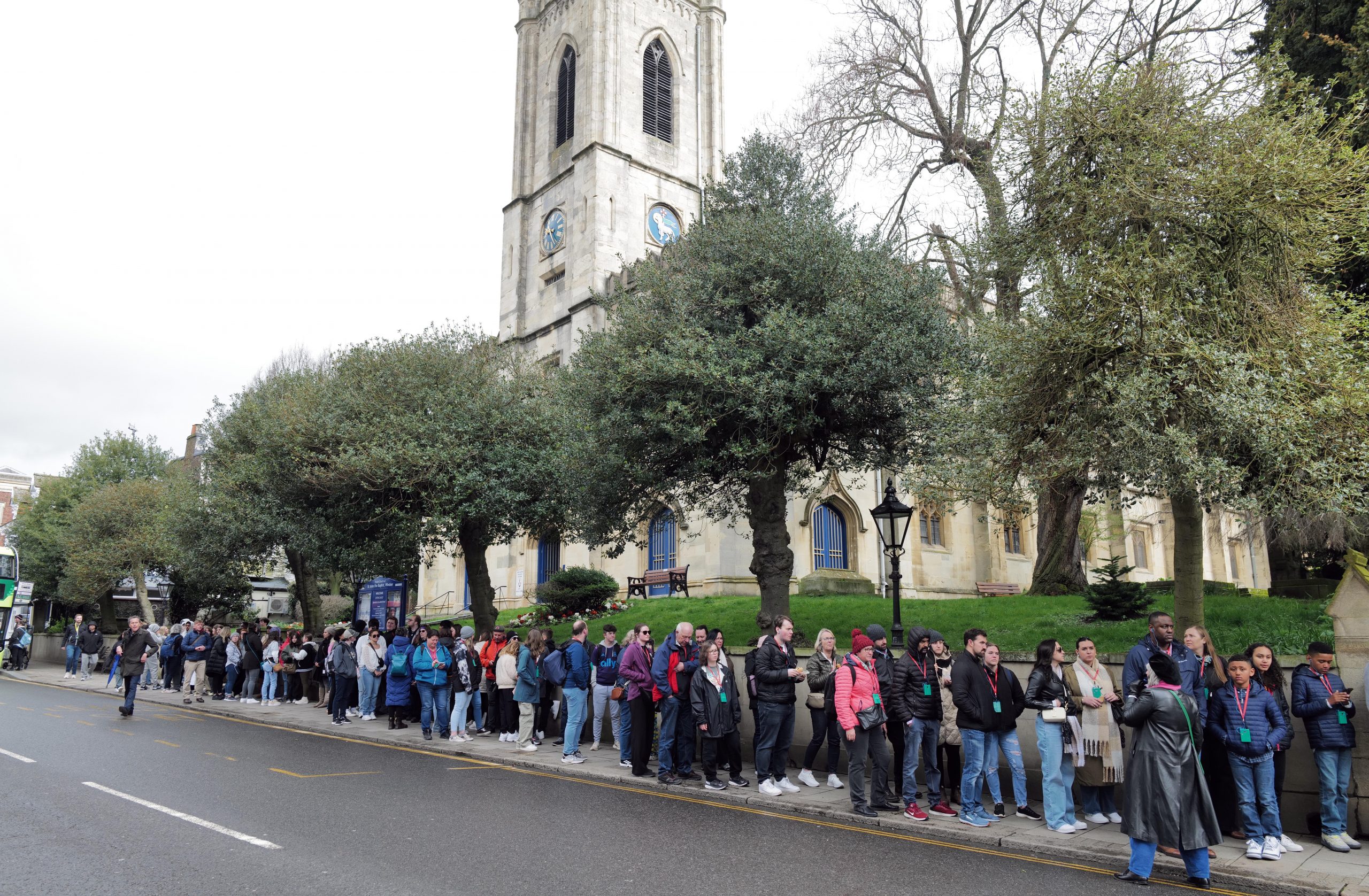 Royal fans wait in mile-long queue for Windsor Castle to show support for the King and Princess Kate amid health battles