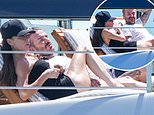 Victoria Beckham flashes her legs in a black mini dress as she joins husband David soaking up the sun on their £5million superyacht in Miami