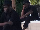 Diddy looks tense as he sits outside his Miami mansion… amid mounting lawsuits and sex trafficking probe