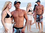 Ellie Goulding slips into a skimpy black bikini as she cosies up to her surf instructor boyfriend Armando Perez on a romantic beach day in Costa Rica