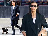 Irina Shayk looks chic in black as she walks puppy in New York City… amid claims star is on the lookout for new famous partner following Tom Brady split