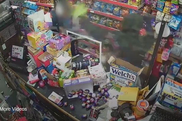 Terrifying moment armed robber points gun and shopkeeper’s head before beating him