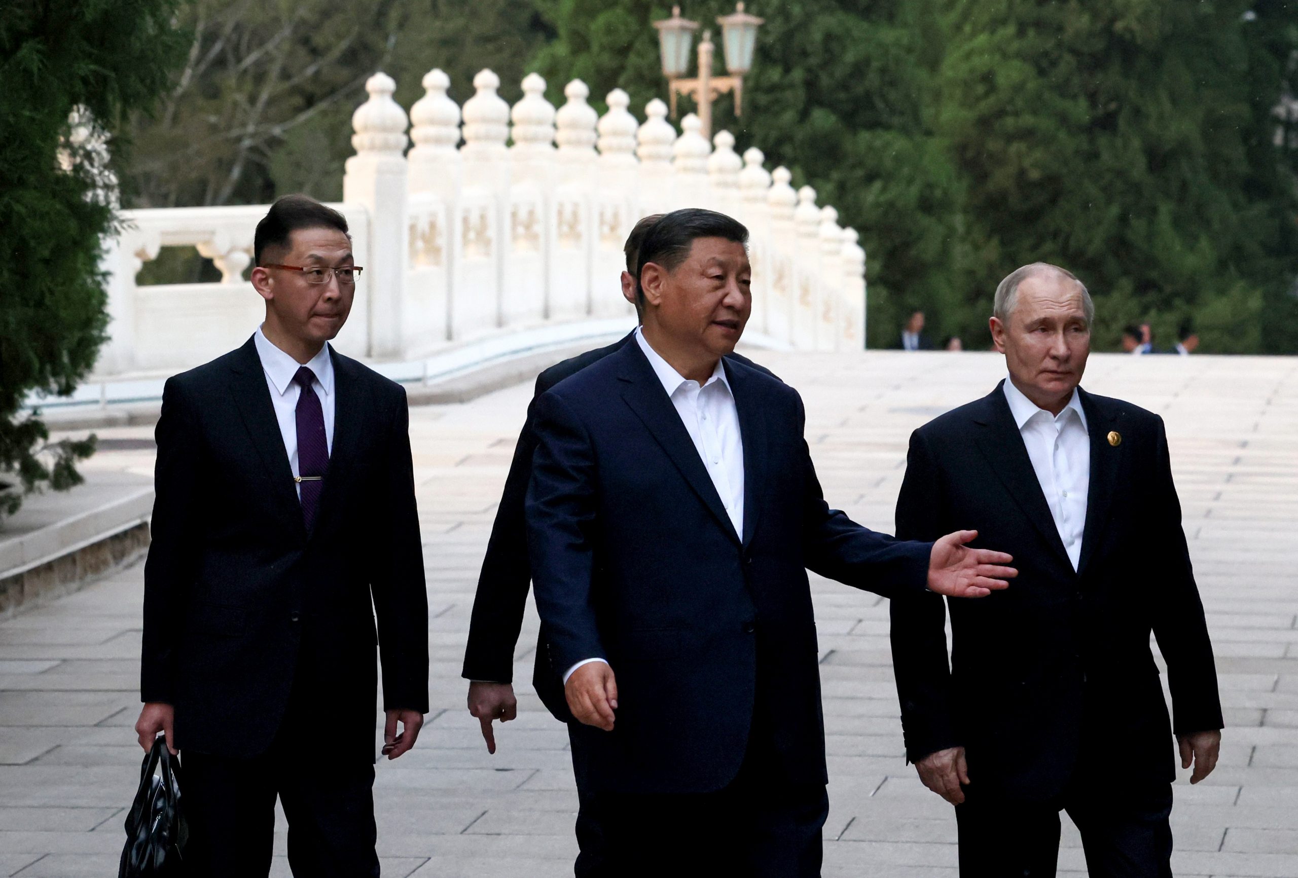 Bizarre moment Xi and Putin go in for TWO HUGS in unprecedented touchy-feely embrace during despots’ love-in talks