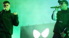 Kneecap defiant at first major gig since terror charge