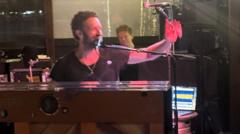 Chris Martin surprises fans with impromptu pub gig